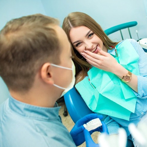 woman talking to her sedation dentist in Midlothian, TX