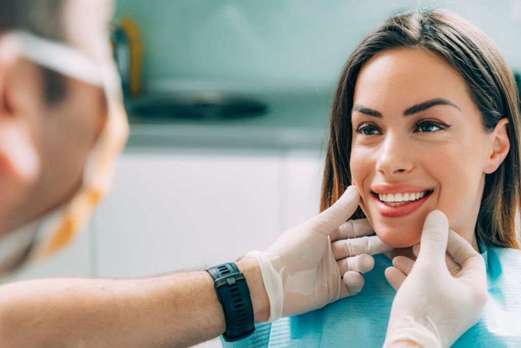 A woman getting a cosmetic dentistry treatment.